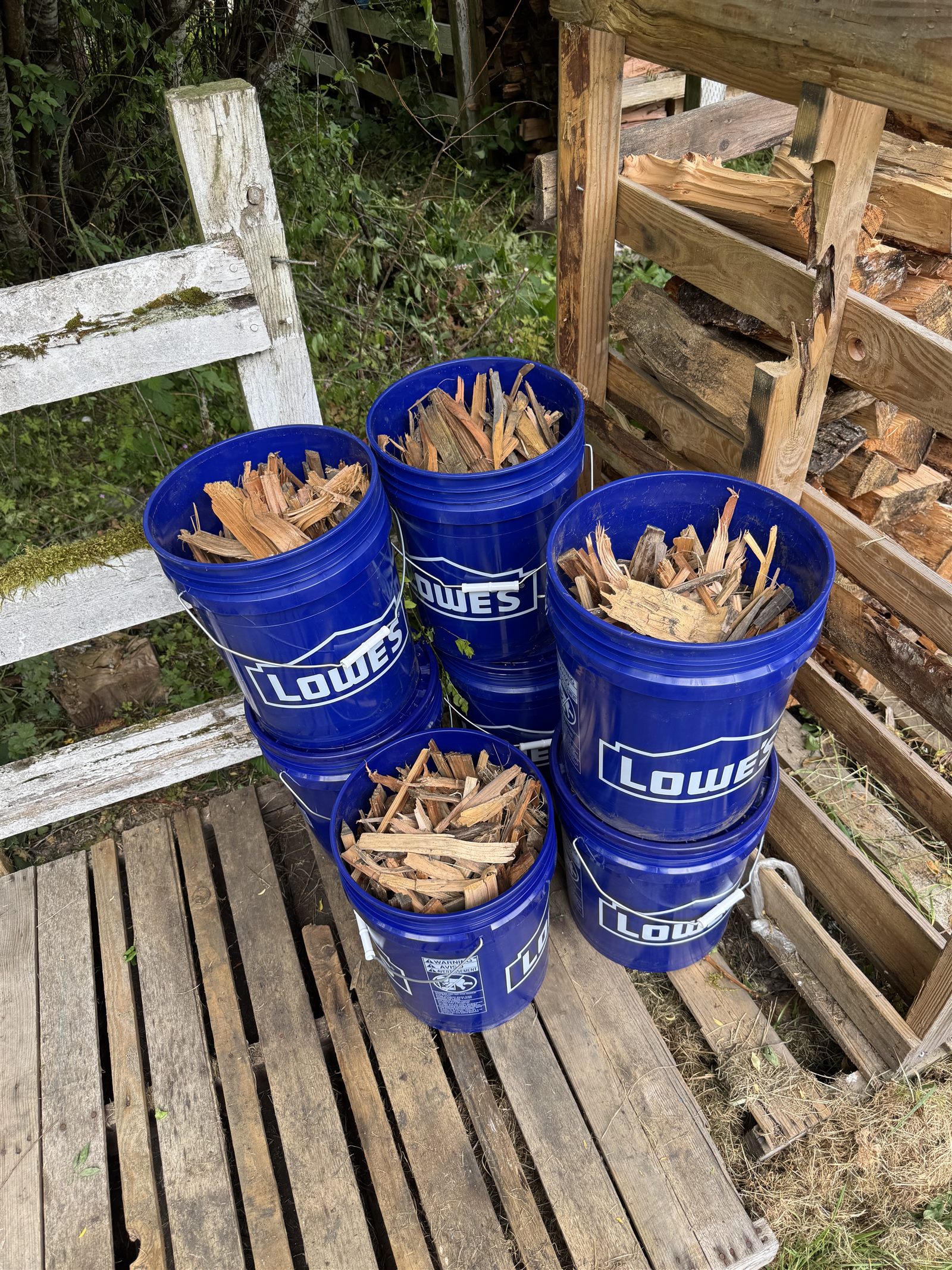 Buckets of kindling and firewood scraps ready for bundling